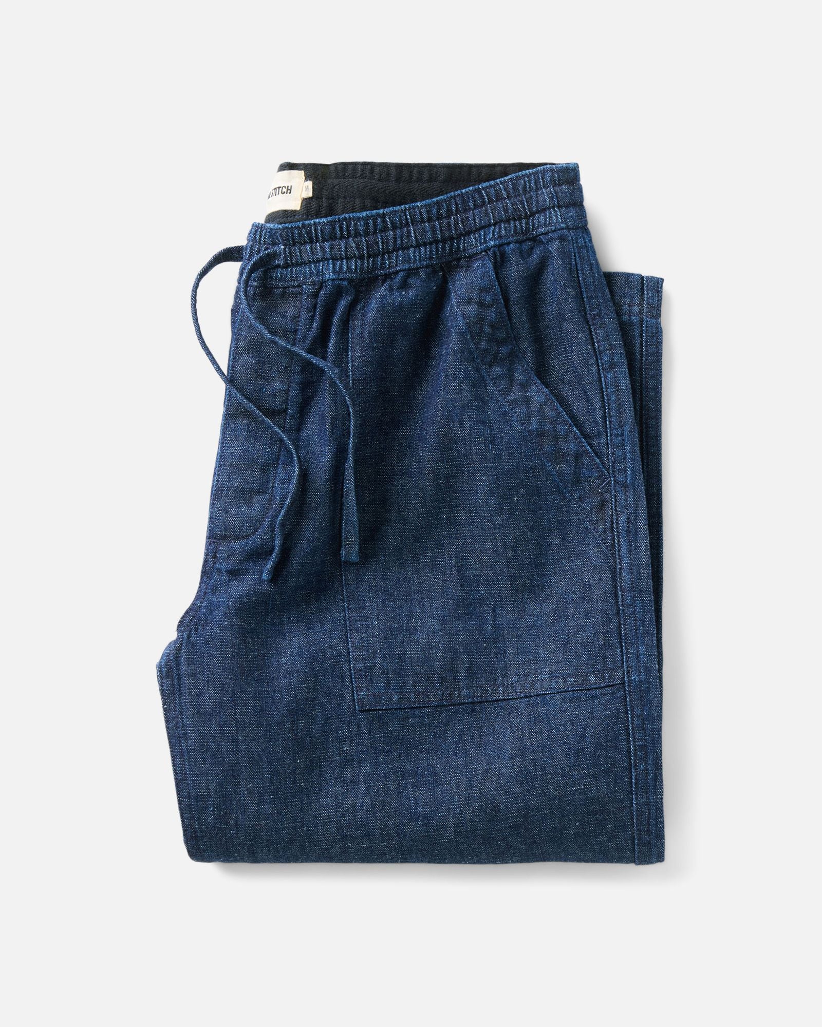 folded flatlay of The Breakwater Pant in Rinsed Indigo Hemp Denim, Bottoms by Taylor Stitch