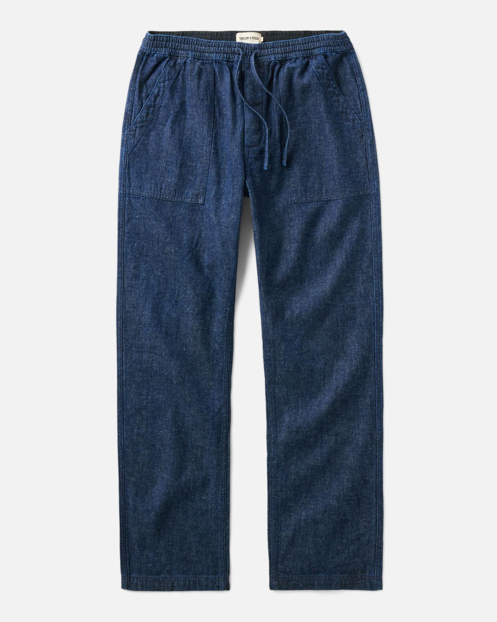 flatlay of The Breakwater Pant in Rinsed Indigo Hemp Denim, Bottoms by Taylor Stitch