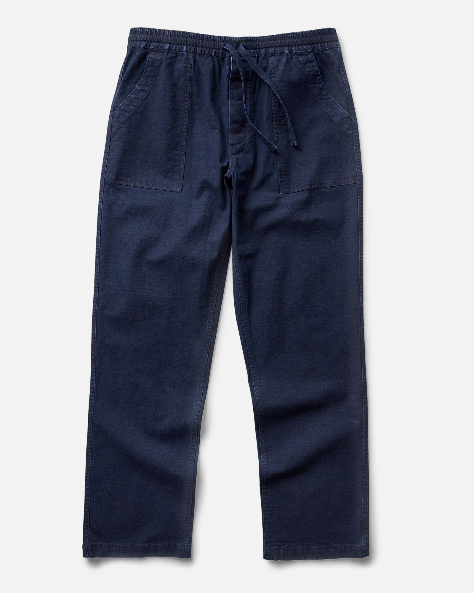 flatlay of The Breakwater Pant in Rinsed Indigo Ripstop, Bottoms by Taylor Stitch