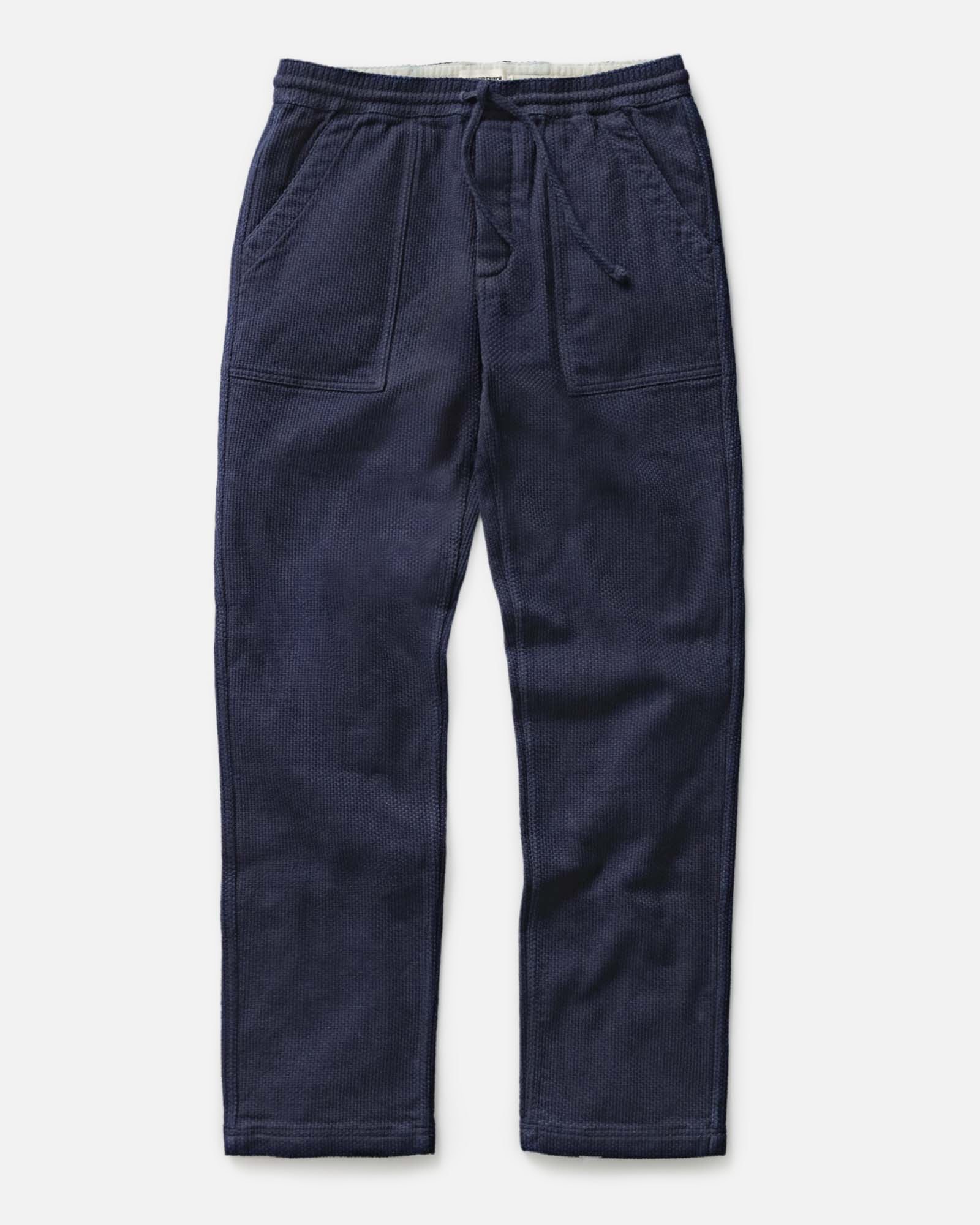flatlay of The Breakwater Pant in Rinsed Indigo Sashiko, Bottoms by Taylor Stitch