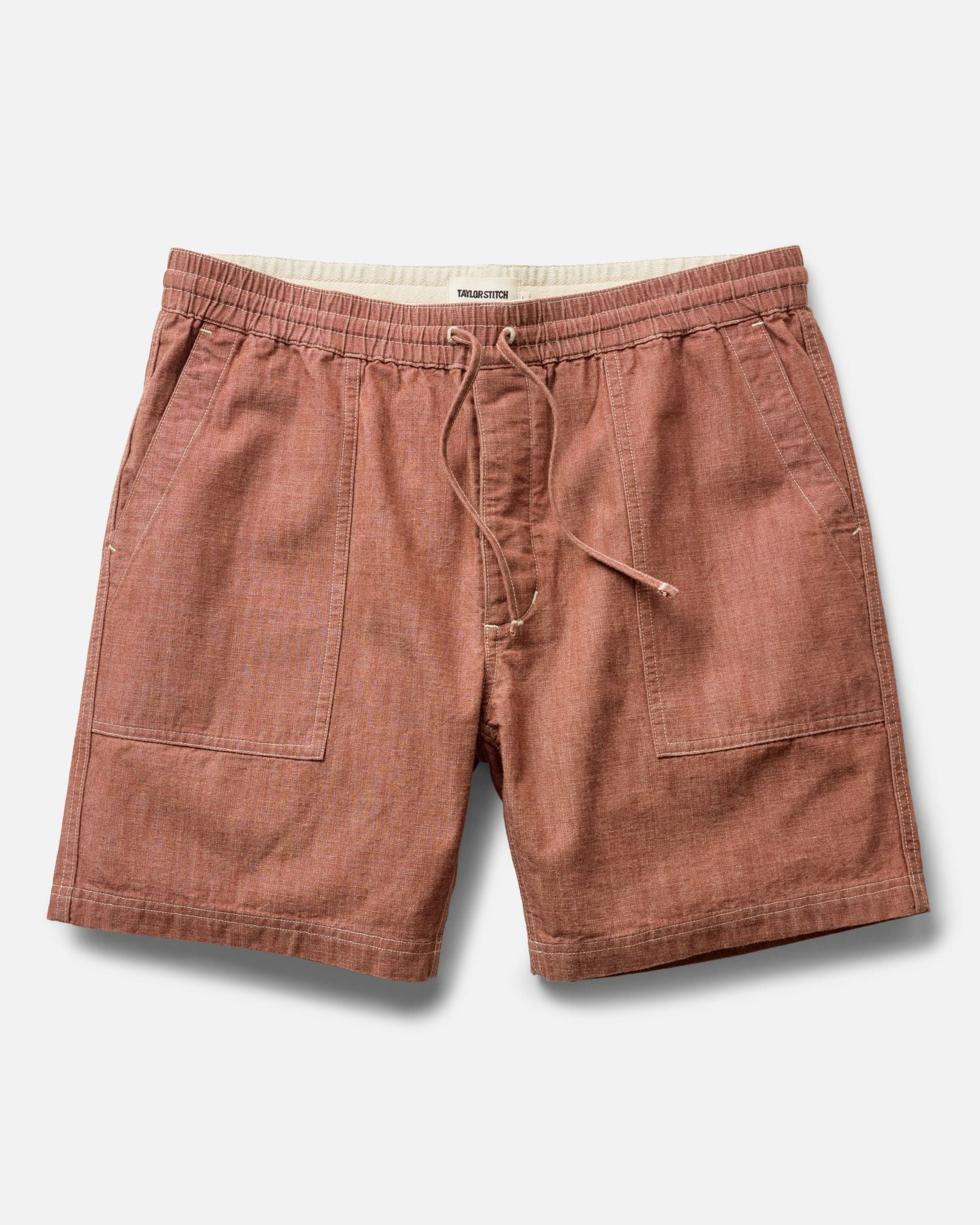 flatlay of The Breakwater Short in Brick Chambray, Bottoms by Taylor Stitch