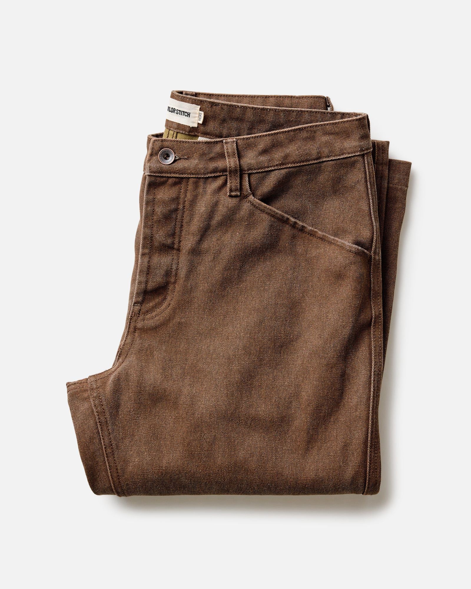 folded flatlay of The Camp Pant in Aged Penny Chipped Canvas, Bottoms by Taylor Stitch