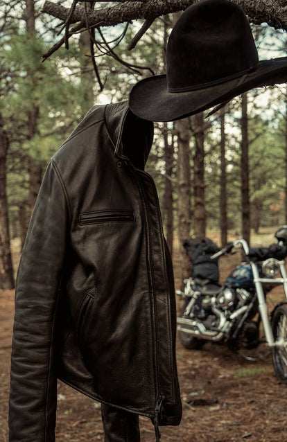 shot of ben in the forest with his jacket