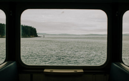 A view of the Pacific Northwest waters out of a ferry window.