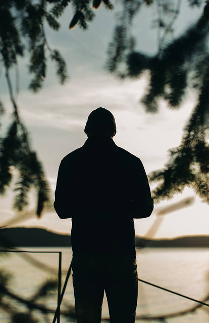 A man looking at the sunset.