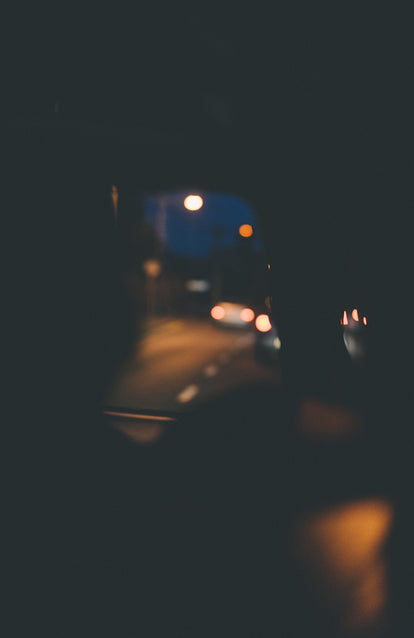 Blurry abstrat of a dark street from within a moving vehicle.