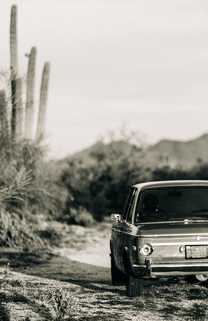 Black and white shot of the BMW on a desert track.