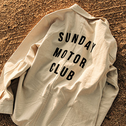 Natural color jacket with 'Sunday Motor Club' screen-printed on the back.