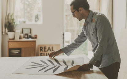 daren laying out his work on a table