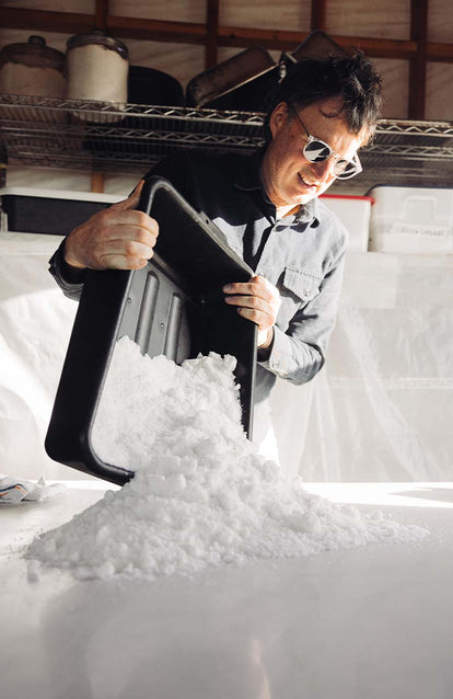 Jeff Warrin tipping salt out of a container