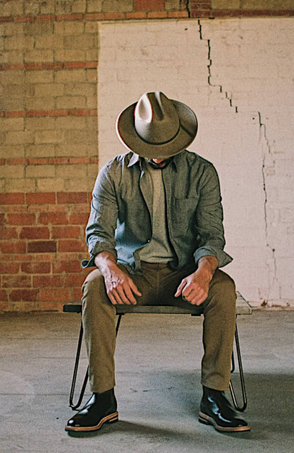A man in a Texas warehouse wearing Taylor Stitch x Stetson.