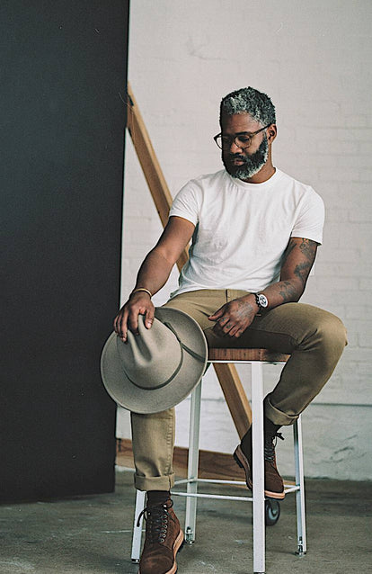 Kirk sitting on a stool in a wearhouse.