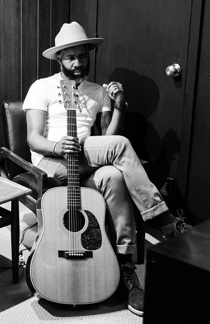 Kirk holding his guitar in the green room.