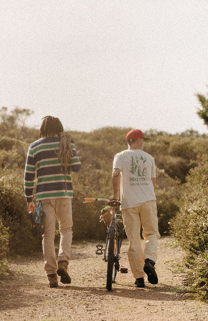 Two guys walking down a trail in Taylor Stitch x Marmot collaboration gear