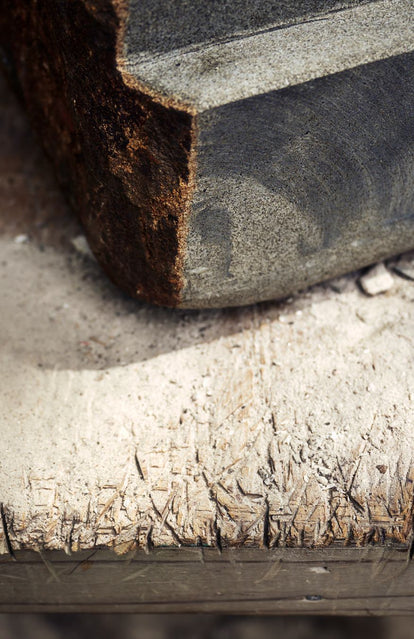 editorial image of stone and wood carvings