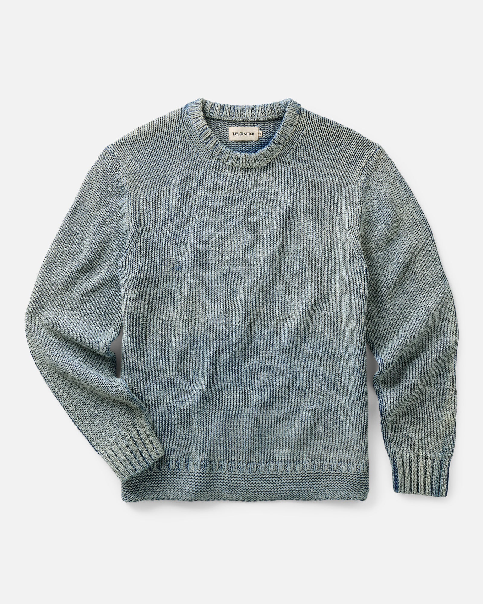 flatlay of The Dory Crew Sweater in Washed Indigo, Knits by Taylor Stitch