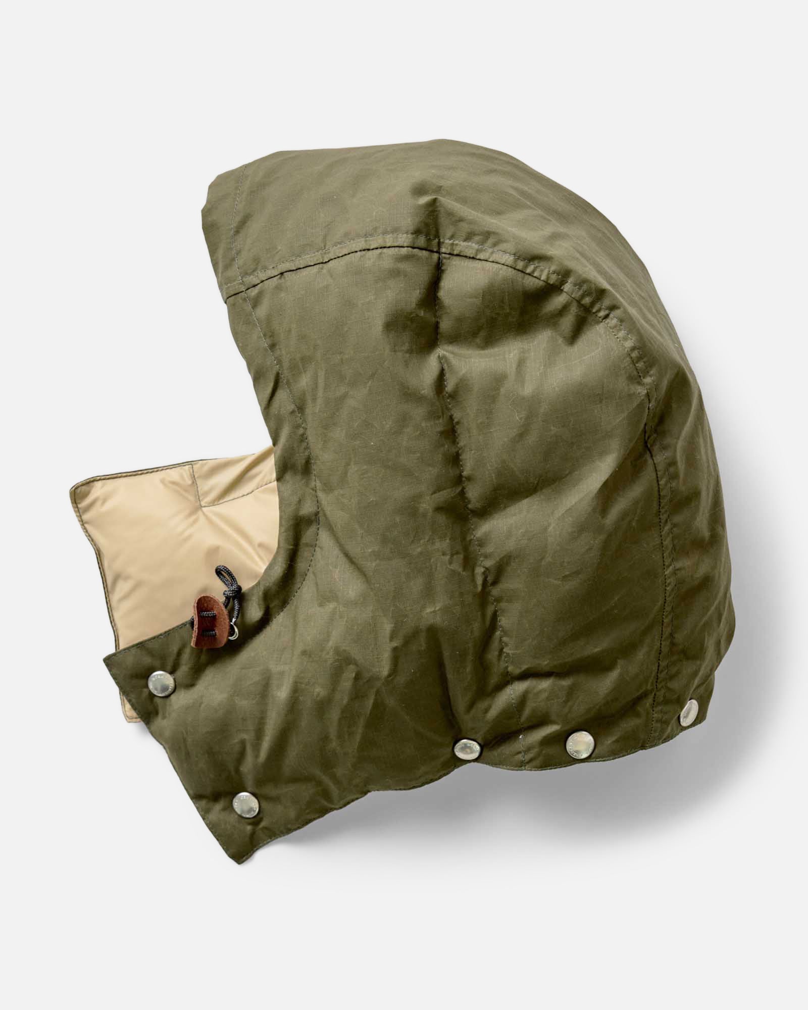 material shot of the detachable hood on The Down Sweater in Olive Waxed Ripstop, Outerwear by Taylor Stitch