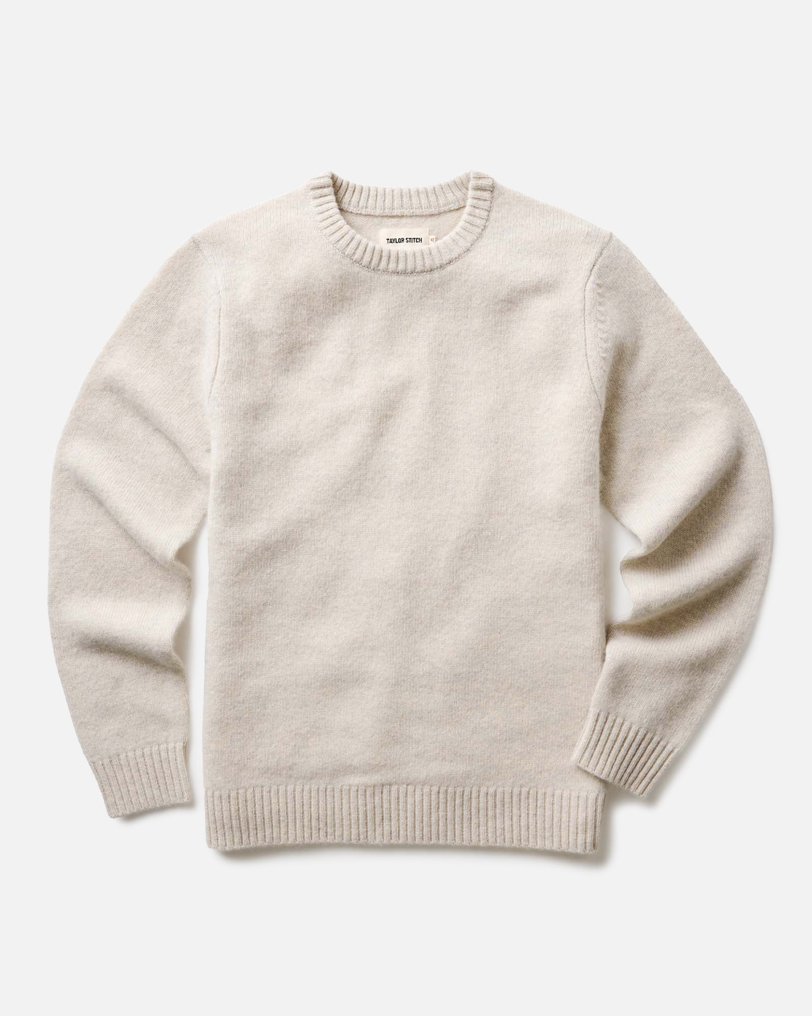 flatlay of The Eastmoor Sweater in Heather Ivory Wool, Knits by Taylor Stitch