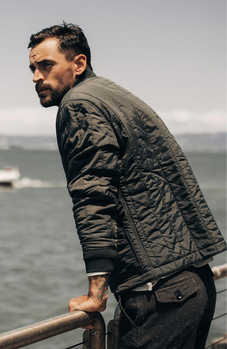 fit model wearing The Able Jacket in Faded Black Quilted Nylon