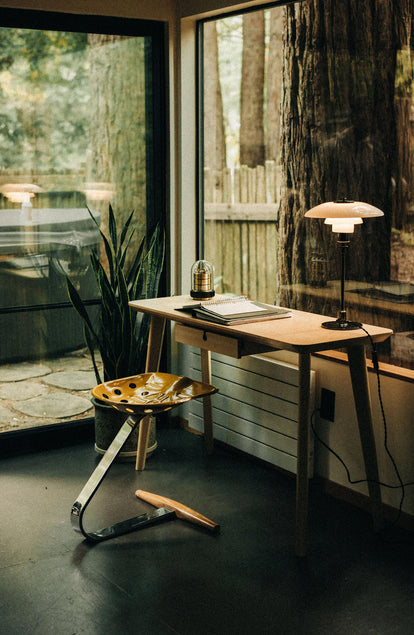 Wooden study desk in a glass home