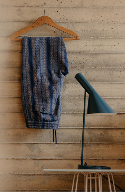editorial image of The Apres Pant in Marine Stripe on a hanger