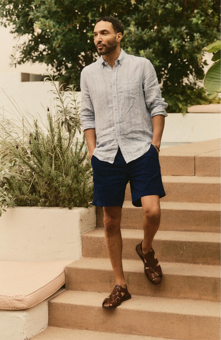 fit model posing in The Apres Short in Rinsed Indigo Pincord