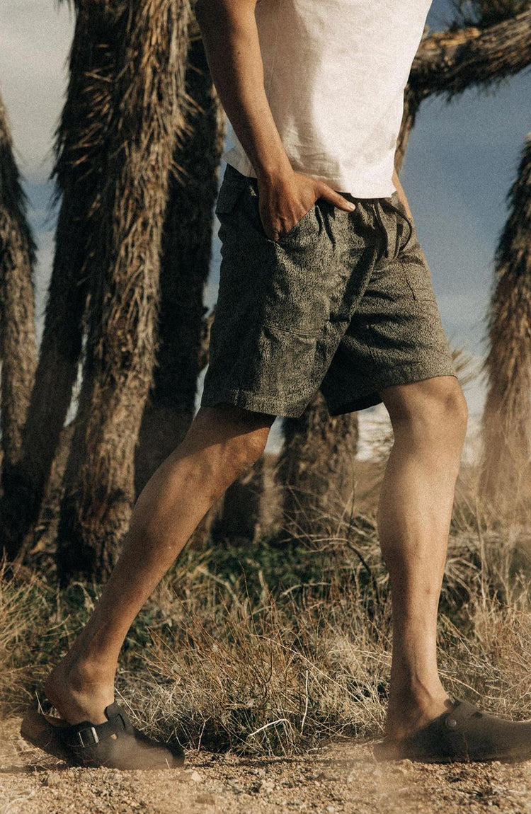 Model wearing The Après Trail Short in Static Camo