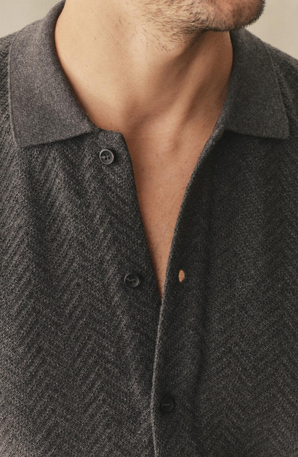 fit model showing off the collar on The Button Down Polo in Charcoal Herringbone