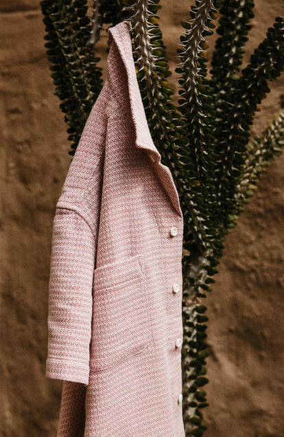 Our model standing in tThe Conrad in Orchid Jacquard