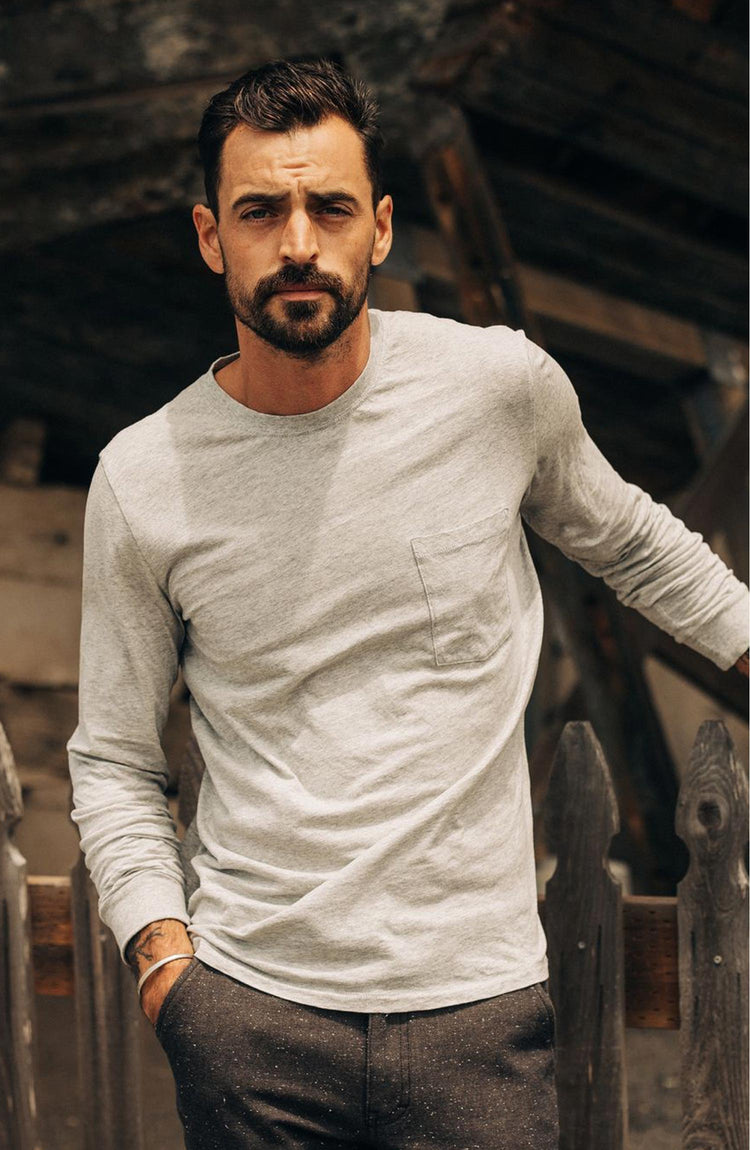 fit model posing in The Cotton Hemp Long Sleeve Tee in Heather Grey