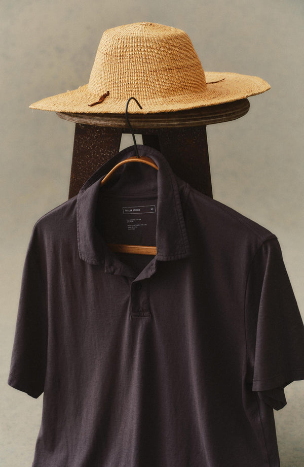 editorial image of The Cotton Hemp Polo in Faded Black hanging
