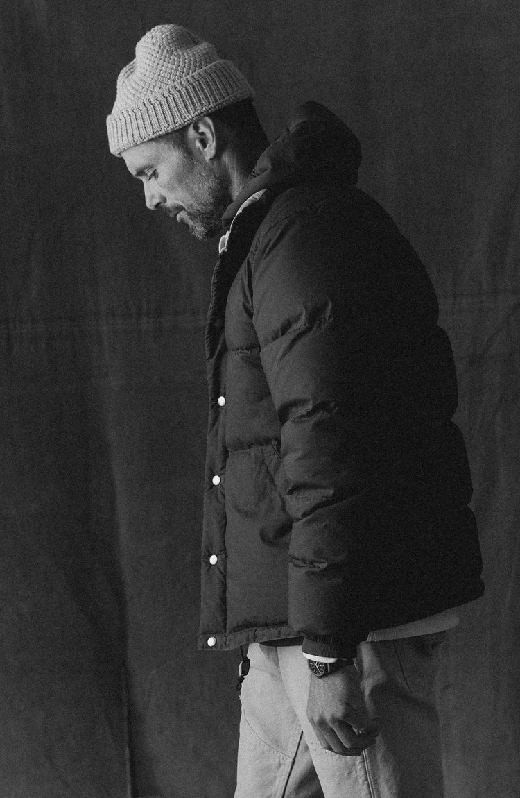 editorial image of The Down Sweater and Down Vest hanging