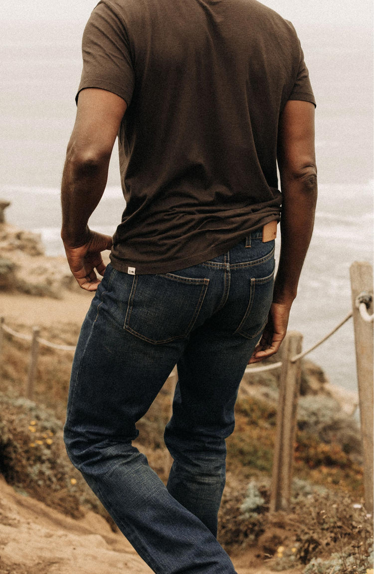 Model wearing The Democratic Brushed Back Jean in Collins Resin Wash Selvage Denim