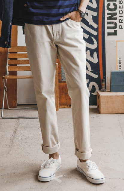 Our model standing in The Democratoc All Day Pant in Dune Canvas