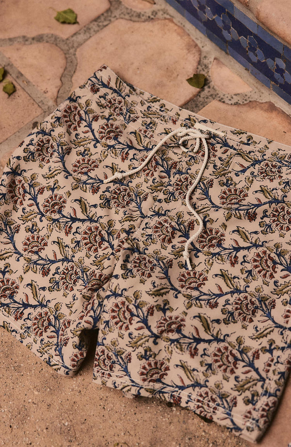 editorial image of The Drift Boardshort in Ivory Floral on the ground