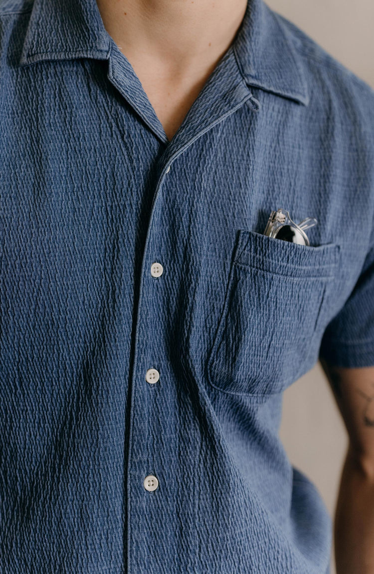 editorial flatlay of the Hawthorne Camp Shirt in Washed Indigo Crepe for Fathers Day
