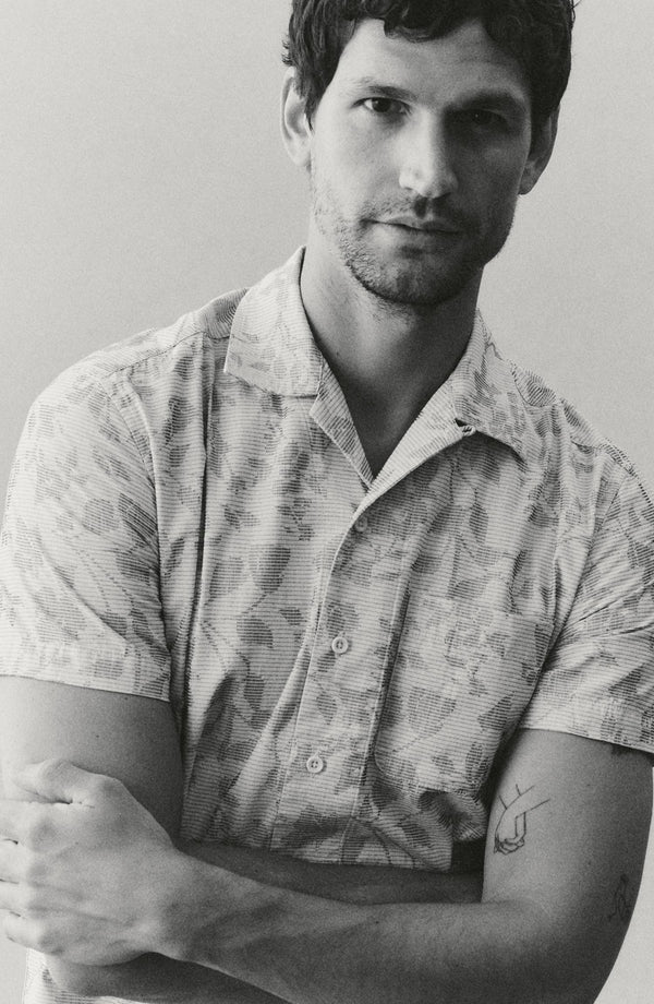 fit model with his arms crossed wearing The Hawthorne Shirt in Sky Blue Floral Jacquard