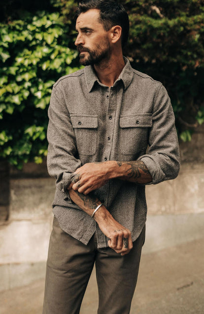 fit model adjusting sleeves on The Ledge Shirt in Granite Linen Tweed
