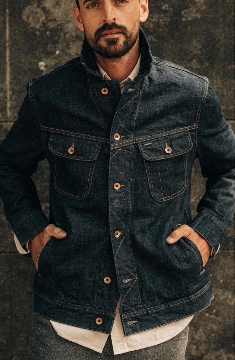 fit model with his hands in the pockets of The Long Haul Jacket in Rinsed Organic Selvage