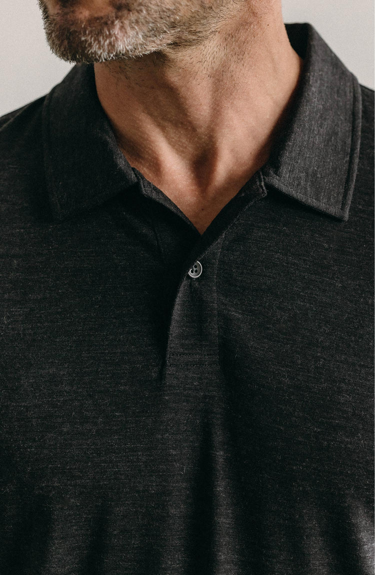 Model wearing The Merino Polo in Heather Black