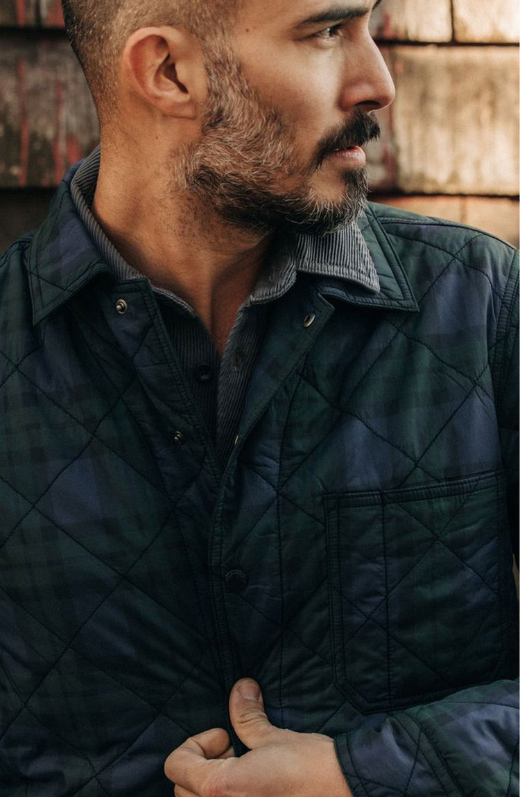 fit model buttoning up The Ojai Jacket in Blackwatch Plaid
