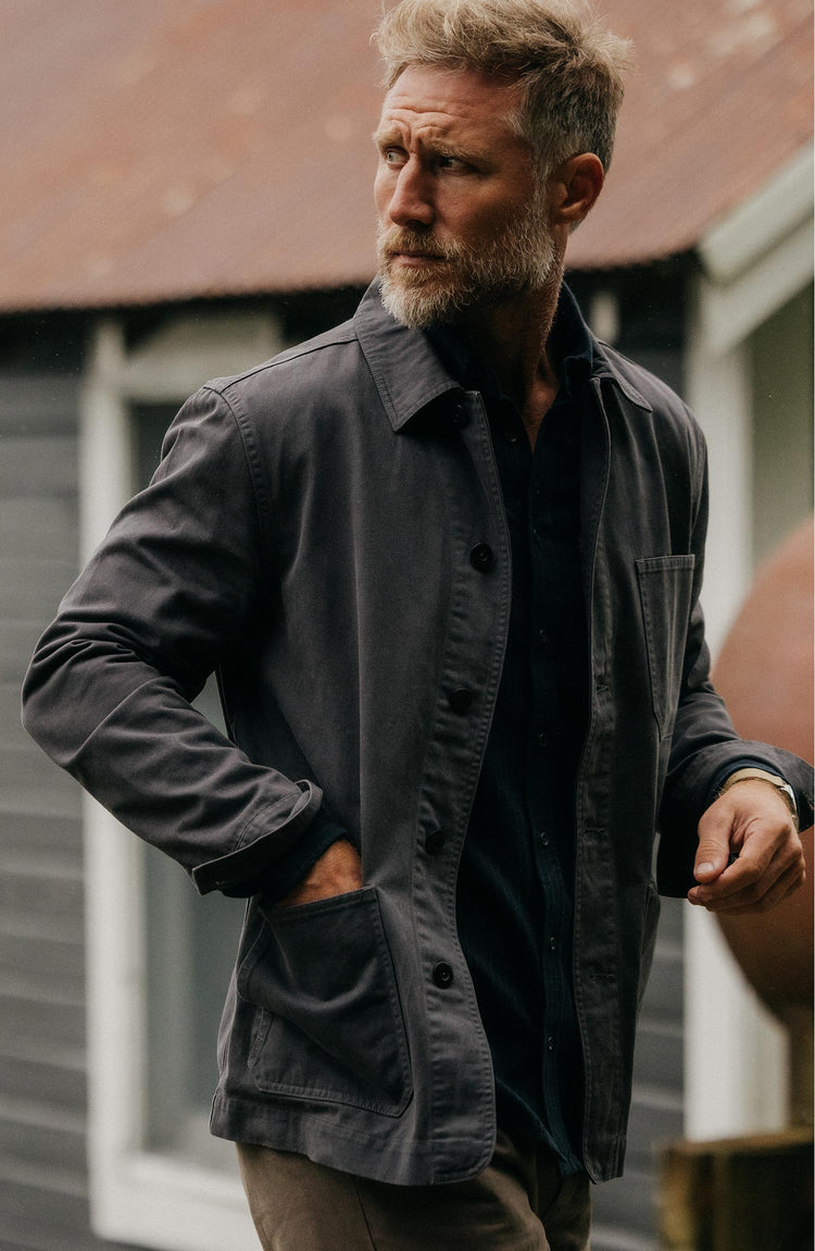 fit model buttoning up The Ojai Jacket in Organic Charcoal Foundation Twill