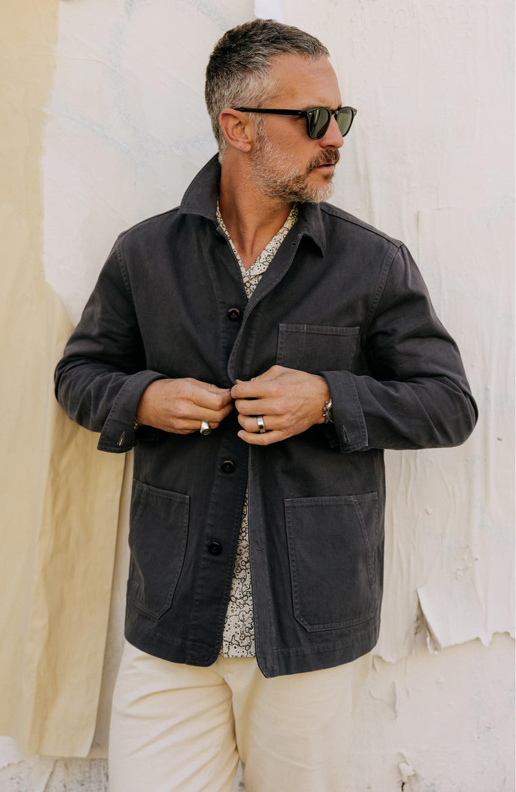 fit model buttoning up The Ojai Jacket in Organic Charcoal Foundation Twill