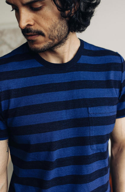 Our model standing in The Organic Cotton Tee in Indigo Yarn Dye Stripe