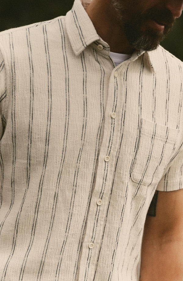 fit model showing off The Short Sleeve California in Tide Stripe Hacci