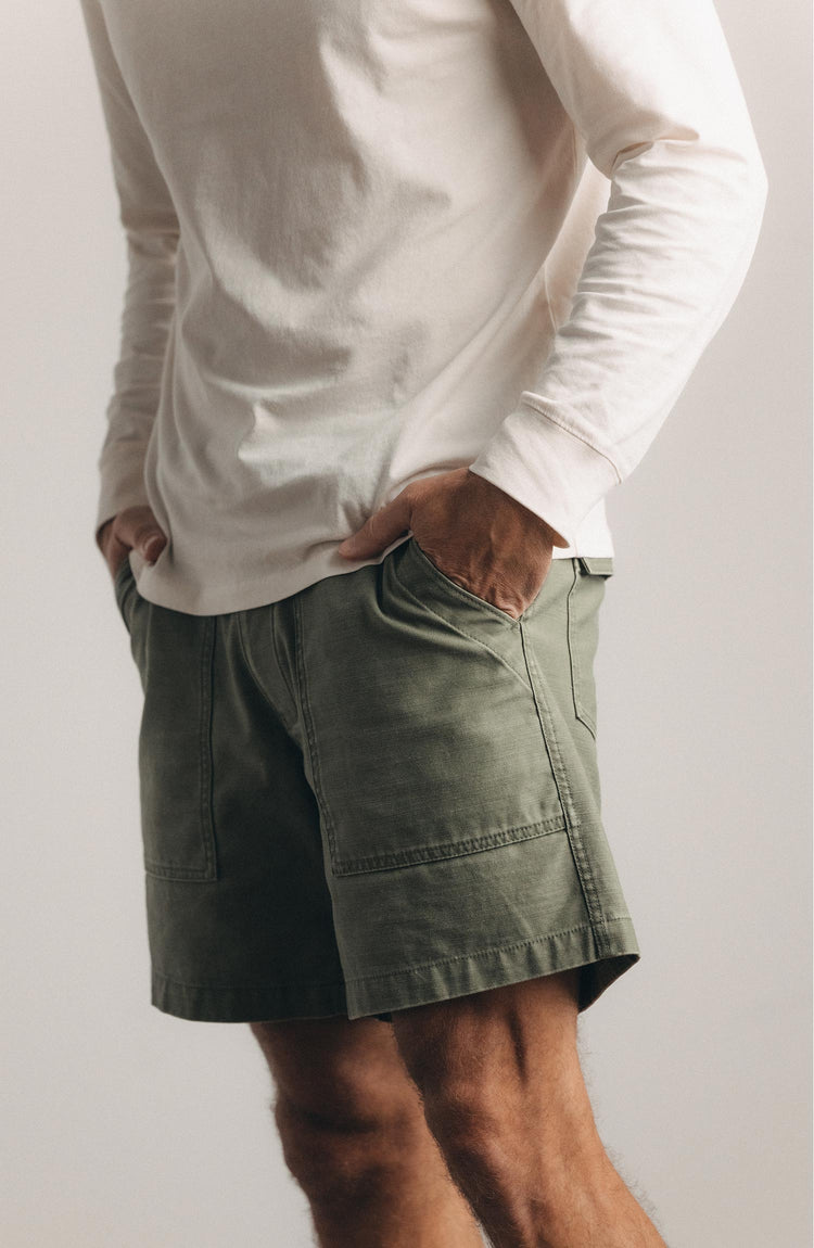 fit model posing in The Surplus Short in Field Olive Reverse Sateen