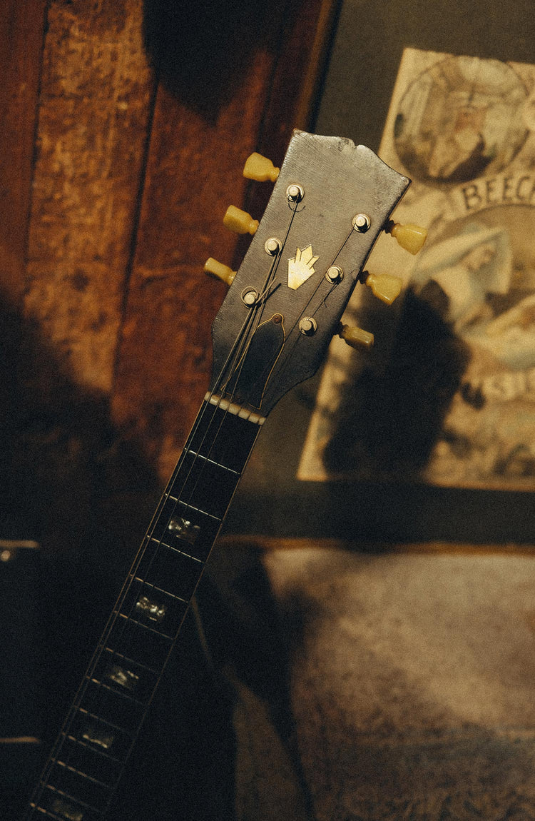 editorial image of a guitar for The Mercer Cap in Delta Blue Twill