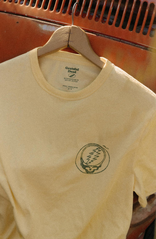 editorial image of The Organic Cotton Tee in Lemon Stamp hanging