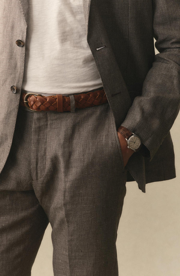 fit model with his hand in his pocket wearing The Stevens Trouser in Morel Micro Check