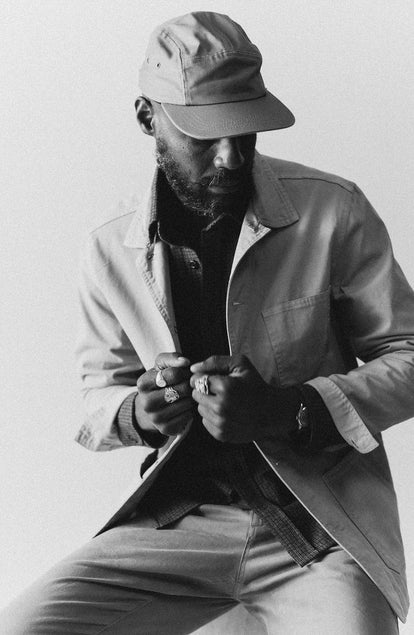 fit model posing in The 5-Panel Cap in Field Olive Reverse Sateen